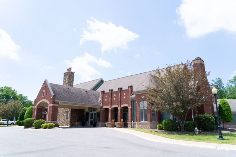 Outside view of Hearthside Senior Living on a sunny day with clouds in the sky
